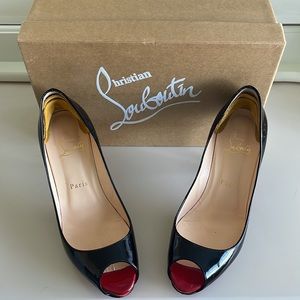 Black with red peep toe Christian Loubution kitten heels. Size 37